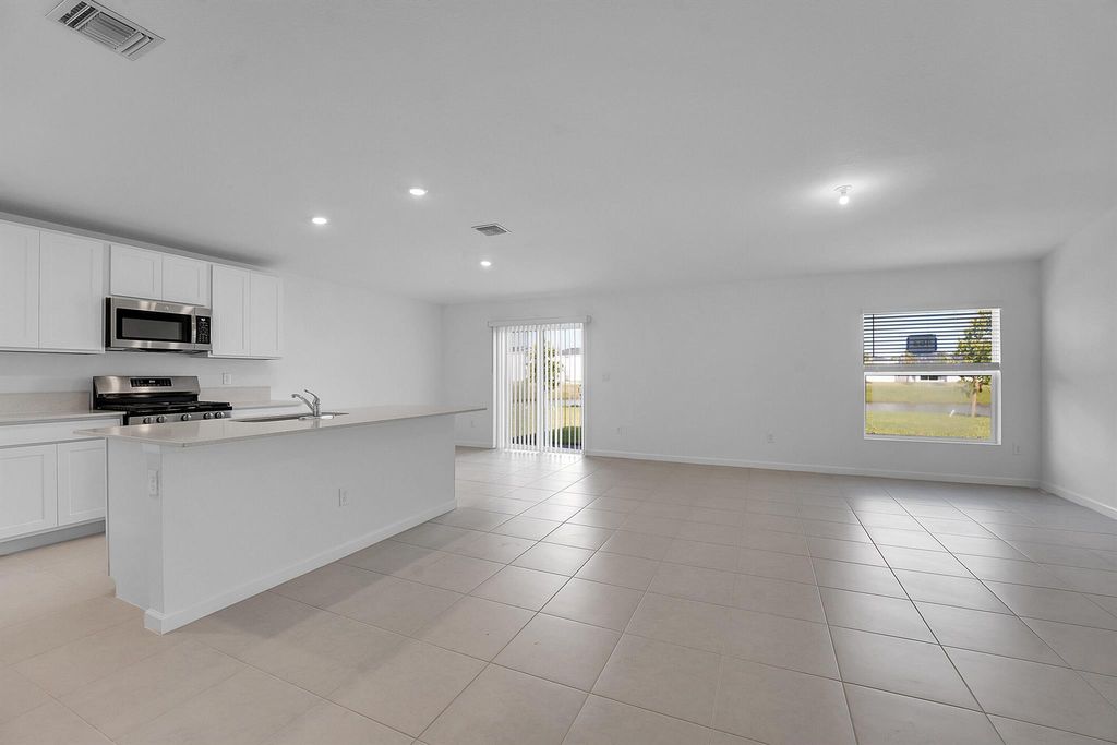 Photo of 5936 NW Mangrove Drive, Port Saint Lucie, FL 34987 (MLS # R11077895)