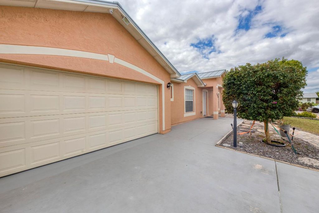 Photo of 586 SW Kaabe Avenue, Port Saint Lucie, FL 34953 (MLS # R11138758)