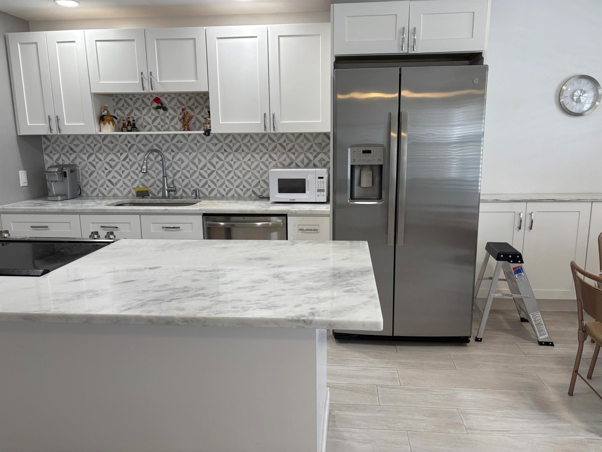 BRING ALL OFFERS. Don't miss this opportunity to own this beautifully renovated Exeter Condo, Open kitchen has custom white cabinets with pull out drawers, stainless steel appliances, quartzite counter tops. Bathroom is completely remodeled and beautifully tiled with walk-in shower. Wood like plank tile throughout. Insta-Hot water heater. Panoramic lake view from beautifully tiled terrace. This condo has it all. 55+ community partially furnished.