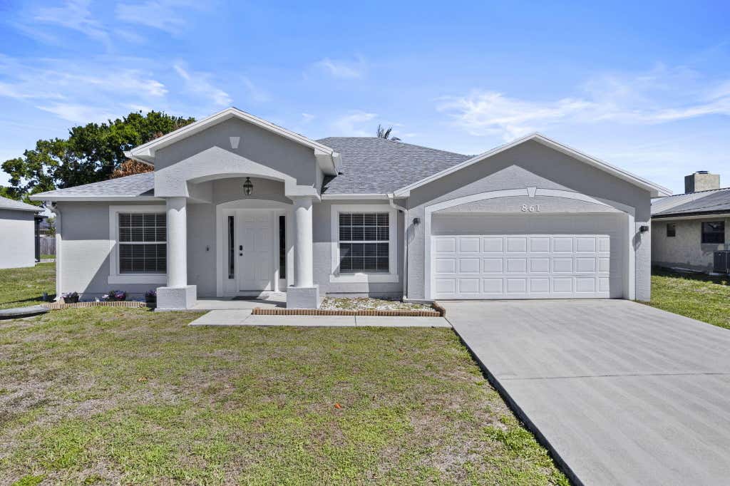 Photo of 861 SE Cavern Avenue, Port Saint Lucie, FL 34983 (MLS # B26006757)