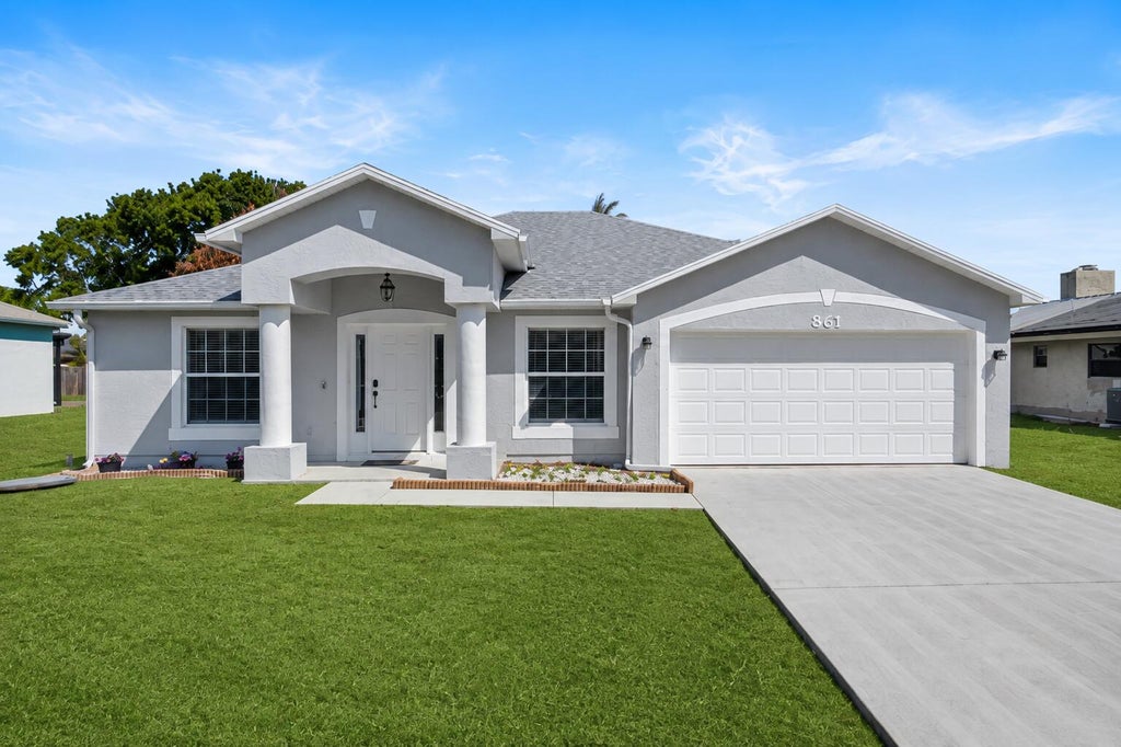 Photo of 861 SE Cavern Avenue, Port Saint Lucie, FL 34983 (MLS # B26006757)