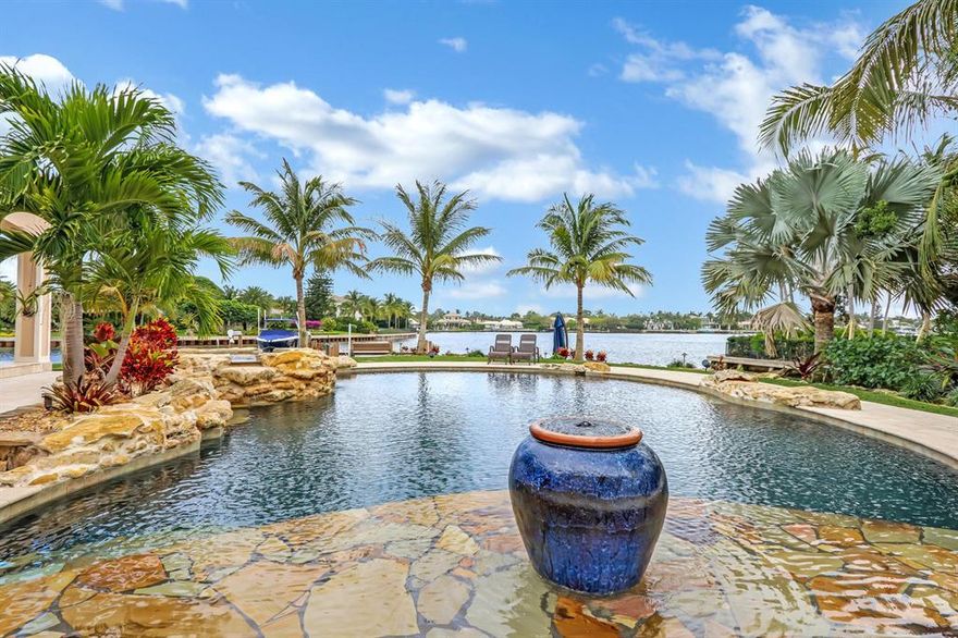 Waterfront beauty with wide lagoon views, expansive dock and resort-style backyard! A rare gem in North Palm Beach, this stunning estate home has been meticulously remodeled and upgraded with smart technology and air purification. With first and second floor master suite options, an elevator, full in-home theater with en-suite bath and an incredible outdoor living area, this home leaves nothing to be desired! Soaring 12 foot ceilings in the first floor living areas and a second floor above! Chef's kitchen with Thermador appliances, stone countertops ample prep, entertaining and storage space.  Outside boasts a saltwater smart pool and spa, two fire pits, waterfall feature wall and views of Lost Tree and Hidden Key.  Virtual showings available at your convenience!
