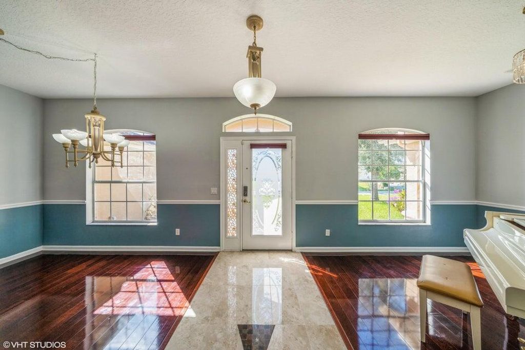 Photo of 5493 NW Evanston Avenue, Port Saint Lucie, FL 34983 (MLS # R10969244)