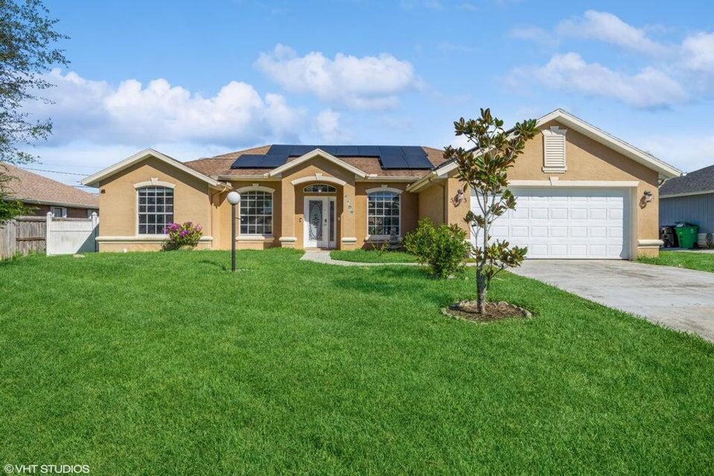 Photo of 5493 NW Evanston Avenue, Port Saint Lucie, FL 34983 (MLS # R10969244)