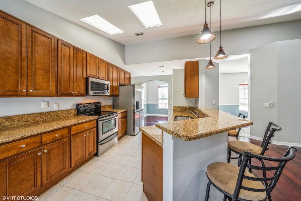 Photo of 5493 NW Evanston Avenue, Port Saint Lucie, FL 34983 (MLS # R10969244)