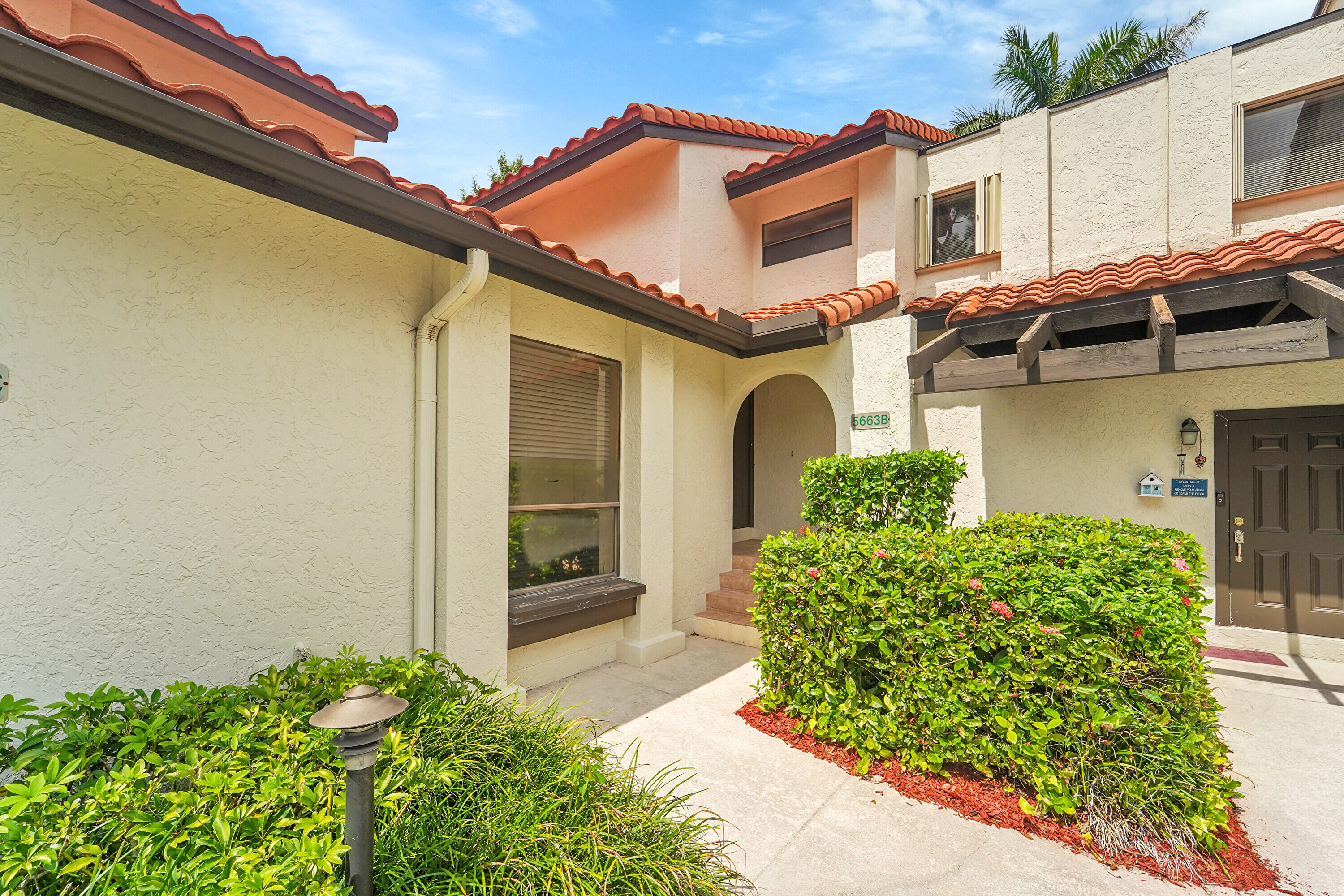 Charming 2/2.1 townhome located in one of the most desirable areas of Boca Raton in a guard gated community. This pristine home features upgraded kitchen and bathrooms, tile floors on main level, brand new rugs, all newly painted, new hot water heater The living and dining area are bright and airy with lots of windows and large sliding glass doors leading out to a private fully fenced patio great for entertaining or just relaxing. Upstairs has all new carpeting there is a secluded balcony off the primary bedroom with a large walk-in closet. Additional features include a powder room and laundry area on main floor. The community offers a pool, walking & bike trails Pets are allowed up to 35lbs. This home is located in prime central Boca Raton with easy access to the Town Center Mall,