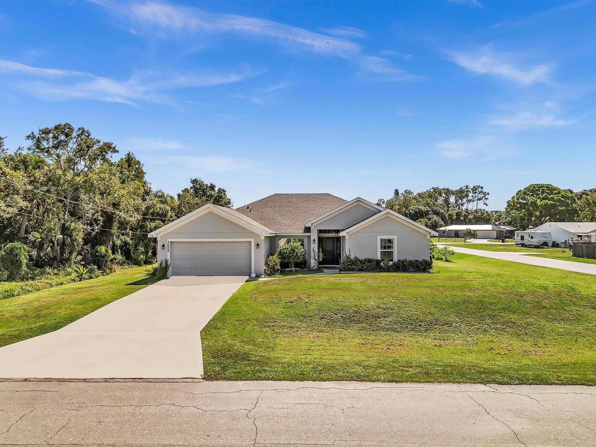 This beautiful property in desirable Indian River Estates, built in 2022, this stunning 4-bedroom, 3-bath home with a 2-car garage offers over 2,100 sq. ft. of thoughtfully designed living space. Situated on a spacious ?-acre lot, the home features an open-concept layout with a split floor plan that balances comfort and functionality.
Inside, you’ll find a welcoming foyer, a formal dining room perfect for gatherings or can be used for a den, office, endless options. A light-filled living area that flows seamlessly into the modern kitchen. The oversized covered patio extends your living space outdoors, creating the ideal setting for entertaining or relaxing while enjoying of the large backyard.
