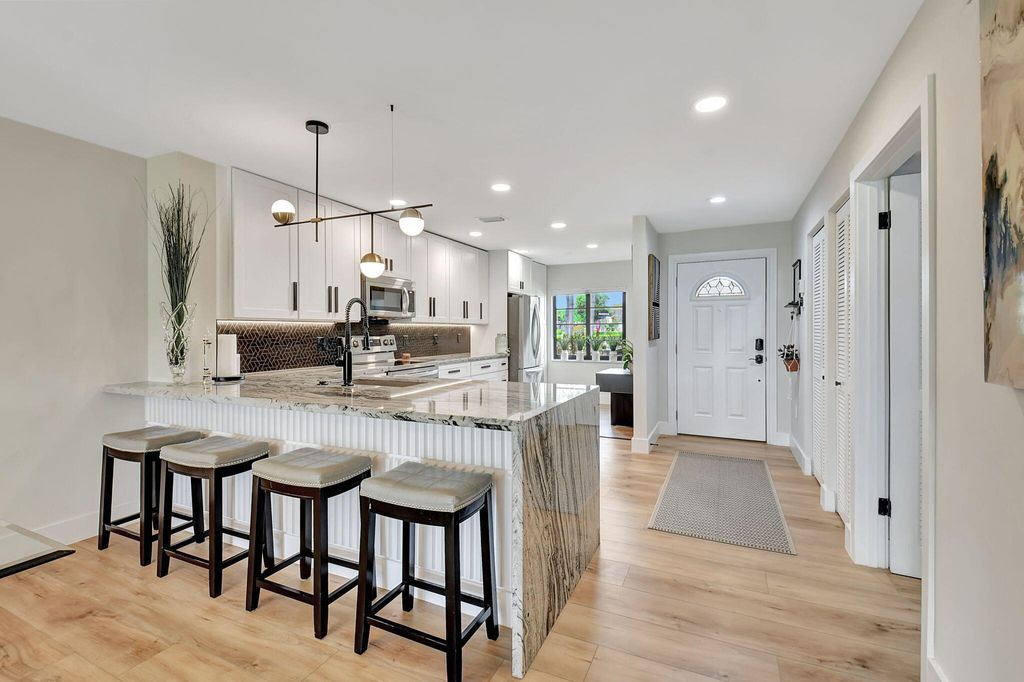 Photo of 3 Stratford Drive #C, Boynton Beach, FL 33436 (MLS # R10965854)