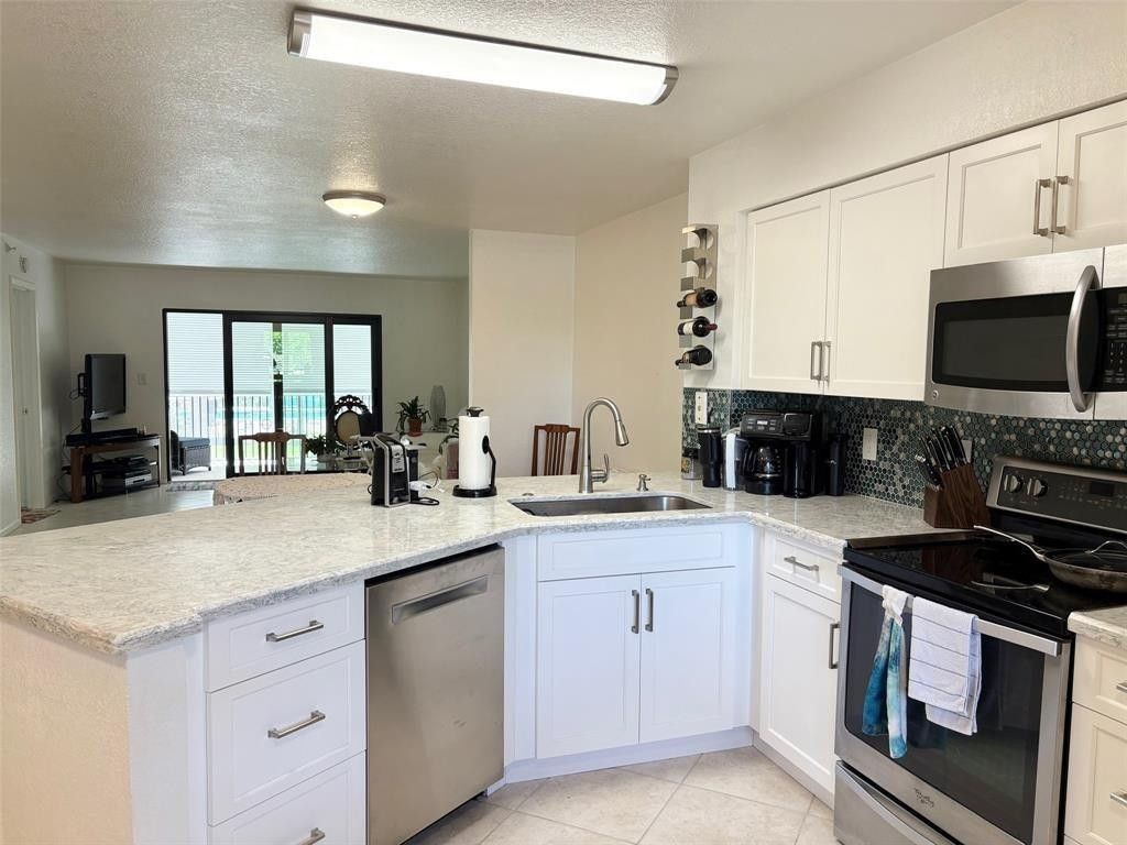 Photo of 2112 S Cypress Bend Drive #203, Pompano Beach, FL 33069 (MLS # F10518824)