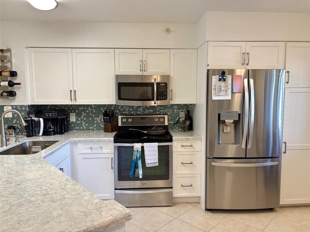 Gorgeous pristine split plan ready to move in condo. SS appliances, quartzite countertops, beautiful soft close cabintery, full size washer/dryer in the unit. Hurricane windows and sliders and hurricane shutters. Huge master suite with walk in shower and walk in closet. Large screened in porch with views of pool, lakes, beautiful trees and lush landscaping. Cypress Bend is a hidden jewel with lakes, walking/running paths, bird sanctuary, fitness center, clubhouse, pickleball and tennis. All ages. This community is close to everything, shopping, restaurants and the exciting new "Pomp" neighborhood being developed. Top Golf, new restaurants coming, entertainment and condos and townhomes priced from 400K to 700K. This whole area is up and coming. The beach is 5 miles away as the crow flies!!