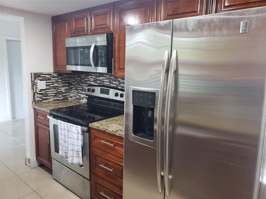 Photo of 7815 NW 73rd Ave, Tamarac, FL 33321 (MLS # F10541278)