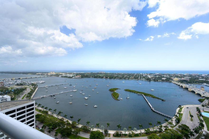 First time on the market in 24 years, one of only four Grand Penthouses at The Plaza. Classic elegance abounds, boasting 12 ft. ceilings with dome ceilings in the entry foyer leading into the grand living space with a fireplace at the focal point, complimenting the unparalleled panoramic views of the intracoastal, the island Palm Beach, and Atlantic Ocean. Chef's kitchen, separate butler's pantry, staff powder room, laundry room. and impact windows. Private dining room, executive office with custom cabinetry with spectacular water views. Situated on a prestigious Flagler Drive, The Plaza's 5 Star Service is unrivaled including 24-hour valet, two pools, a tennis court, pickleball, an exercise room, and a club room