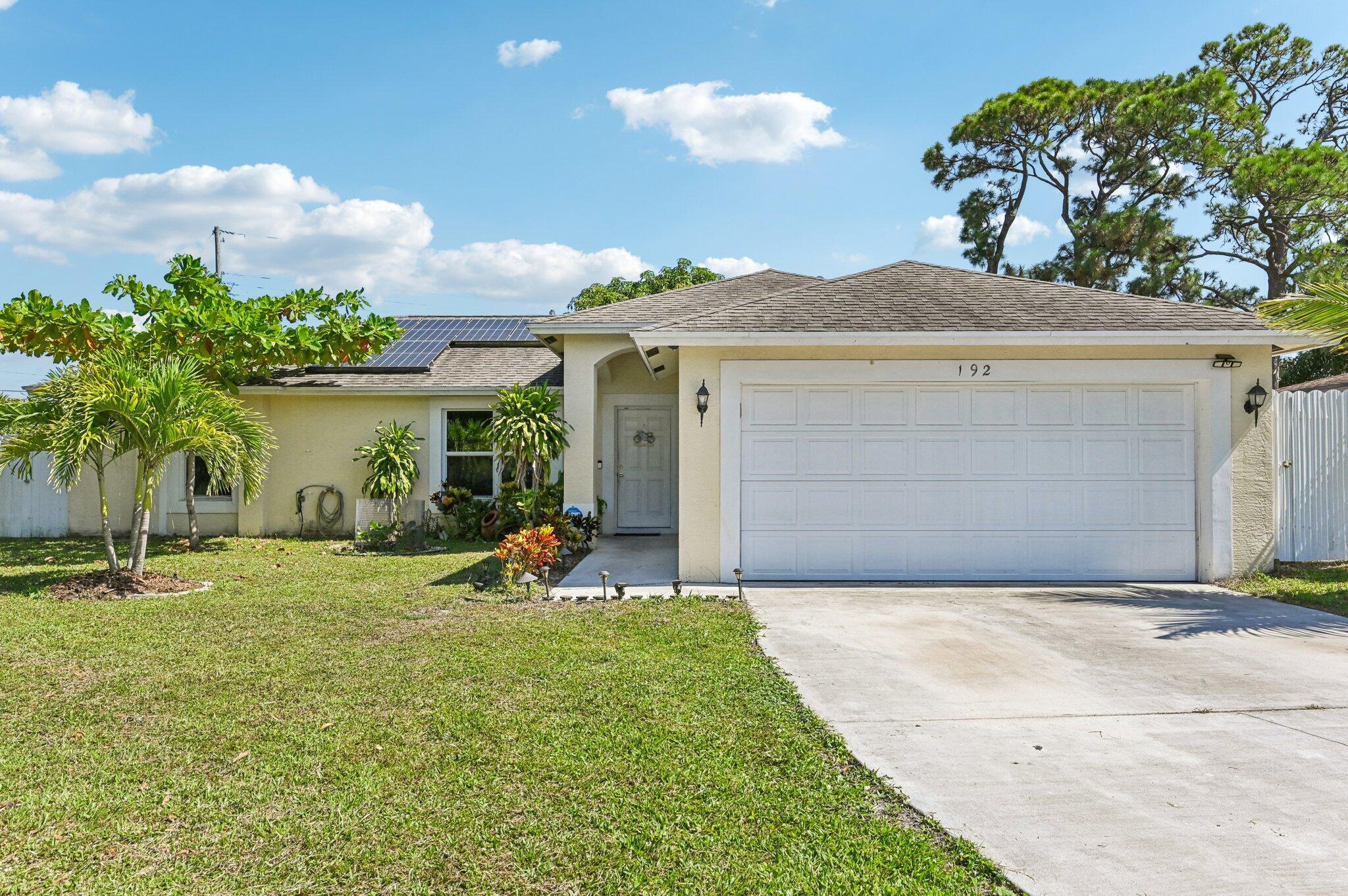 Located in the heart of Port Saint Lucie, This spacious 3 bedroom, 2 bath home has an open kitchen design, high ceilings, lots of natural light and is move-in-ready...! The home is CBS, has a split bedroom plan, huge screened-in back patio, and large backyard. Located on a quiet street, close to shopping, restaurants, schools, parks, and more. No HOA, and no rental restrictions... it is an excellent investment opportunity or a great place to call home..! Call for a private showing today! solar panel and shed do not convey
