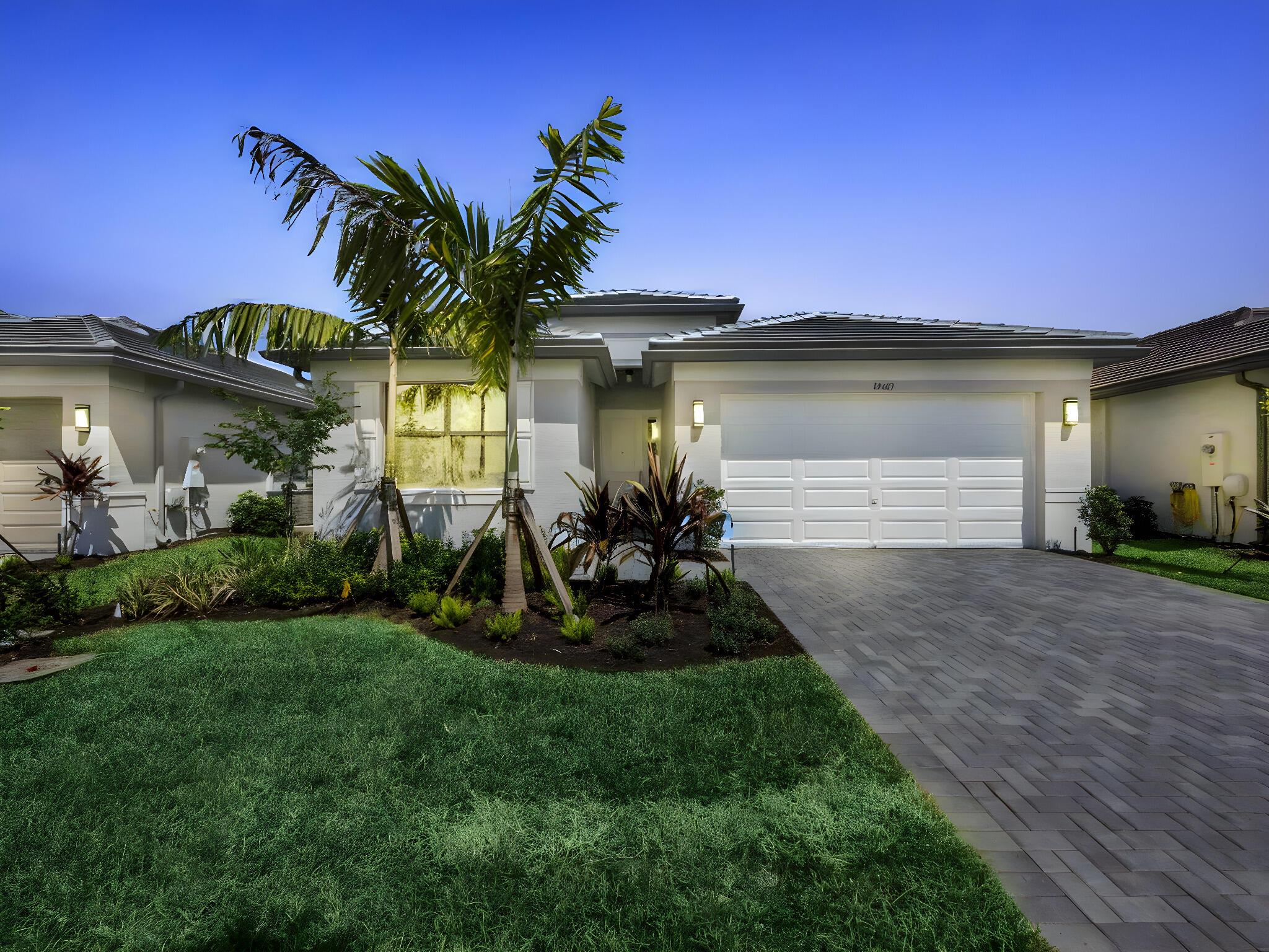 Valencia Parc at Riverland is where you'll find Port St. Lucie's best 55+ lifestyle with a million ways to have fun including a beautiful 38,000-square foot Clubhouse with resort-style amenities. This Sanderling floorplan includes water views and an open floor plan with matte tile flooring throughout the entire home and carpet flooring in the guest bedroom. The home features high end finishes including impact glass windows, GE gas appliances, tile roof, and recessed LED lighting. The kitchen includes quartz countertop with designer tile backsplash, painted maple cabinets, and GE stainless-steel appliances. All bathrooms include high end quartz countertops and painted maple vanity cabinets.