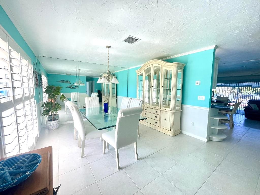 Photo of 880 SE Degan Drive, Port Saint Lucie, FL 34983 (MLS # R11081819)