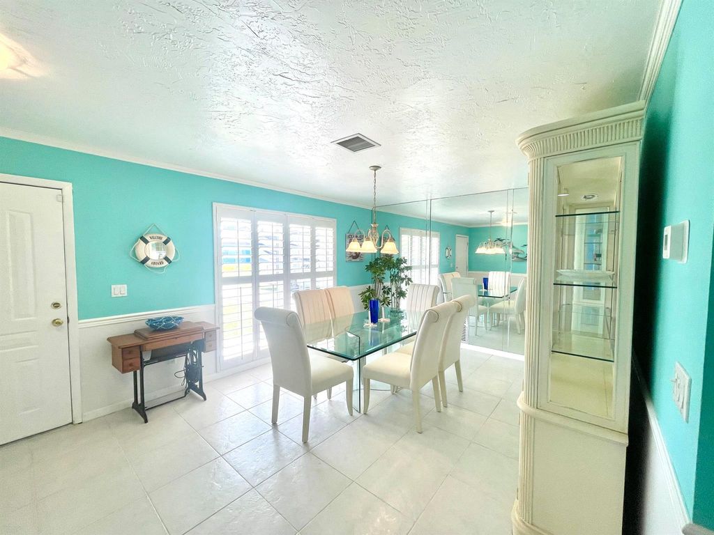 Photo of 880 SE Degan Drive, Port Saint Lucie, FL 34983 (MLS # R11081819)