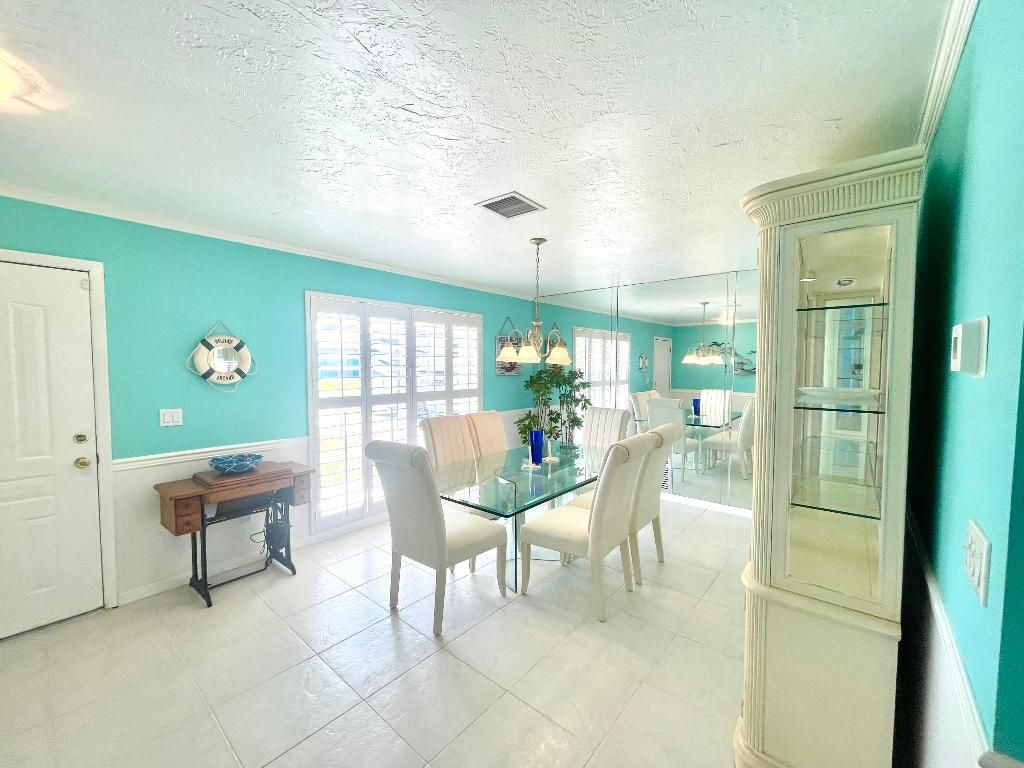 Photo of 880 SE Degan Drive, Port Saint Lucie, FL 34983 (MLS # R11081819)