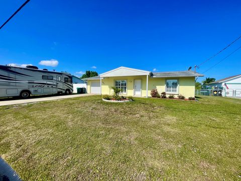 Photo of 880 SE Degan Drive, Port Saint Lucie, FL 34983 (MLS # R11081819)