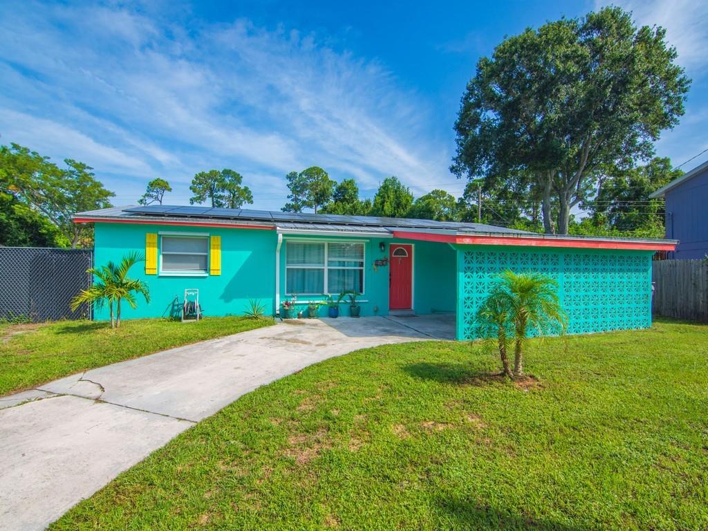 This move-in ready 3-bedroom, 2-bathroom home sits on an oversized private corner lot with plenty of room for a pool and space to bring your RV, boat, or other toys. Freshly painted and filled with natural light, the home features New laminate flooring, a modern kitchen with New granite counters and New stainless steel appliances, a convenient laundry room, and a bright sunroom perfect for relaxing or entertaining. Enjoy the ease of a carport, the privacy of your spacious lot, and the ideal location close to shopping, dining, and the beautiful beaches of Vero Beach.