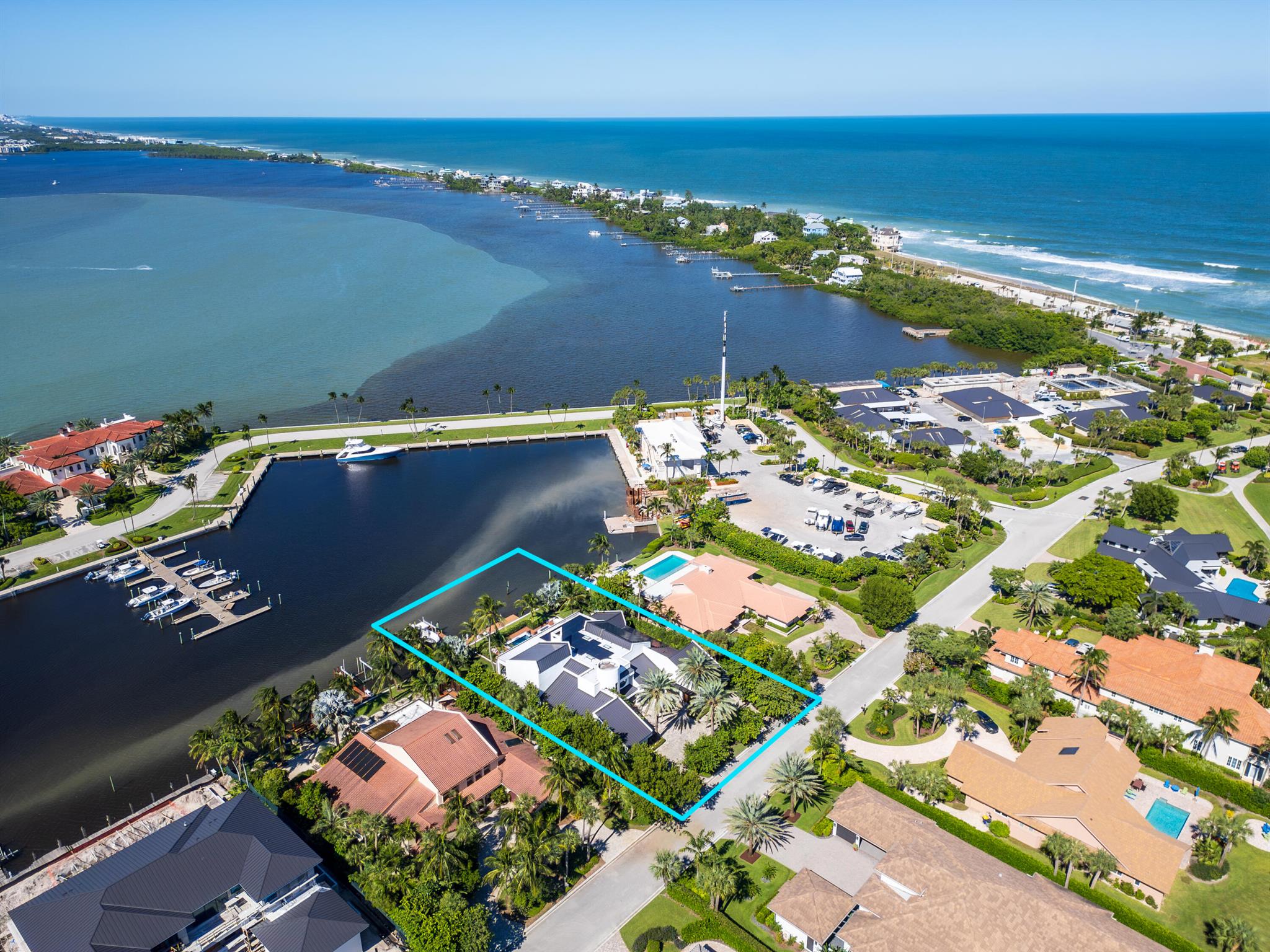 Located on the southern tip of Hutchinson Island in Sailfish Point Country Club, this 8,815-sq-ft modern waterfront estate is one of Stuart's most coveted addresses. Completely reimagined from the studs up, it blends architectural sophistication, cutting-edge technology, and ultimate privacy.A dramatic pivot glass entry opens to light-filled interiors, soaring ceilings, and seamless indoor-outdoor living. The gourmet kitchen showcases custom cabinetry, professional-grade appliances, and expansive entertaining space. Two primary suites--one on each level--offer flexibility, complemented by an elevator-accessed loft capturing sweeping waterfront views.Outdoors, enjoy 115 feet of deep-water dockage with a 20,000-lb boat lift and direct ocean access. The resort-style pool and spa