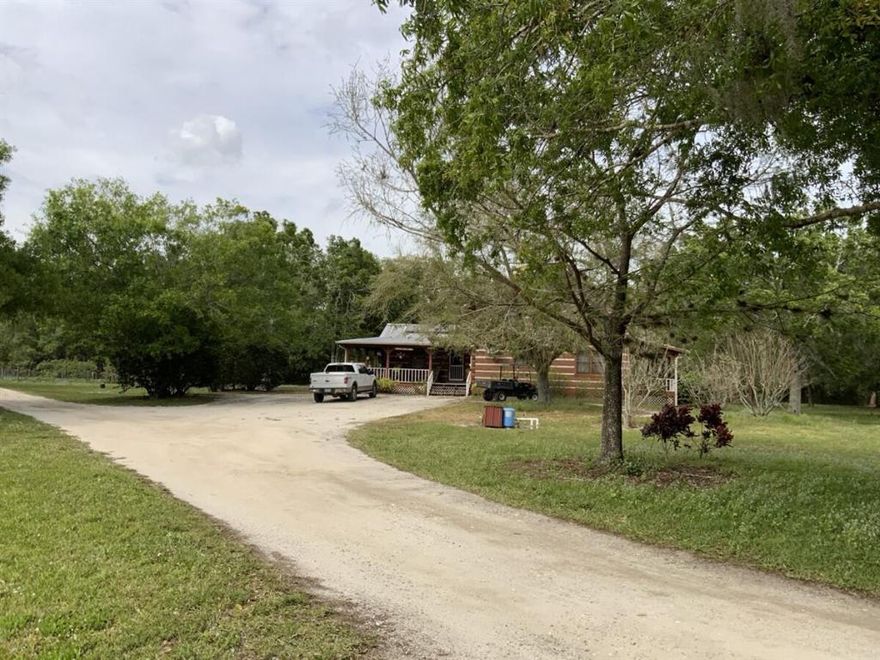 Location! Location! Location! Your own slice of paradise close to town in highly sought after Western St Lucie County (Zip code 34945). Unique 3 bedroom, 2 bath home on 9.81acres. This peaceful and private property includes the following: chicken coops with 100 chickens included, 36x24 barn with overhang, orchid house, 4.5 acres fenced pasture, 4 rows of fruit trees, ditches on all exterior sides of property, 50x75 garden, shed with AC, fenced and irrigated, 2 wells, whole house generator, front porch all the way around kitchen area and side patio. Plenty of room for tractors, trailers, and livestock. A definite must see! Bring your offer. Location! Location! Location! Your own slice of paradise close to town in highly sought after 34945 Zip code area in western St. Lucie County. Unique, 2 story 3 bedroom 2 bath home with large, country eat in kitchen on 9.81 acres.  This property has it all-chicken coop with 100 chickens included, multiple mature fruit trees, fenced garden, shed/sewing room with AC, barn, Orchid house, 4.5 acre pasture, ditches surrounding exterior of property, 2 wells, whole house generator, many mature shade trees . Plenty of room for tractors, trailers, and livestock. A definite must see!