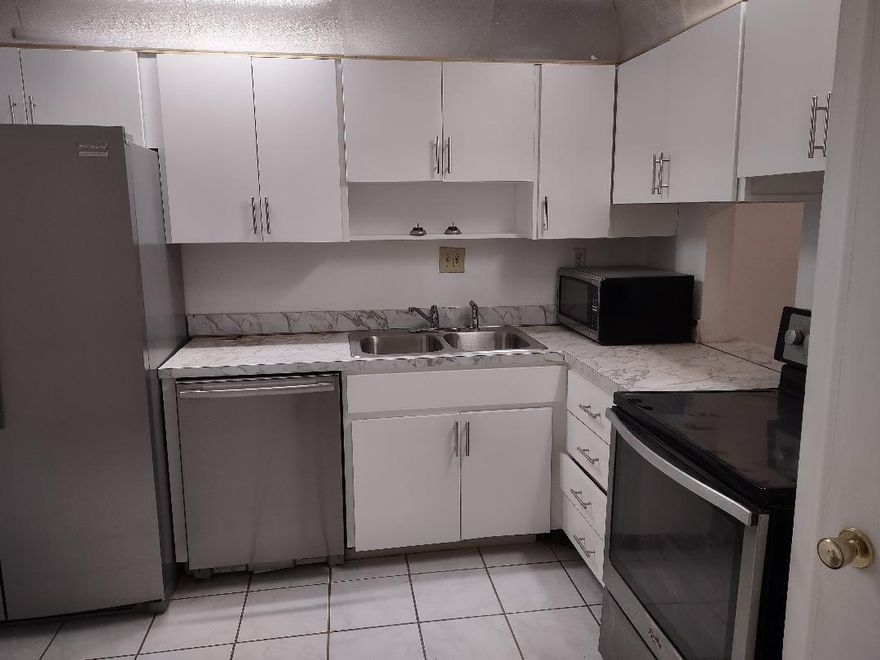 Over 55..Large,convenient ground floor unit with tiled floors throughout,upgraded cabinets in kitchen & bathroom,SS appliances and all within a secure,keyed entry bldg. Bathroom was recently retiled. Eat in kitchen with pantry plus a glass enclosed patio for even more space. Separate vanity area outside bathroom. Ample closets. Newer AC and WH. Unit to be cleaned and painted prior to start of new lease. Complex offers pools,gym,billiards,bowling along with large active Clubhouse. Friendly and conscientious landlord looking for reliable long term tenant. Must have min 650 credit and be able to provide a background check report to submit with application