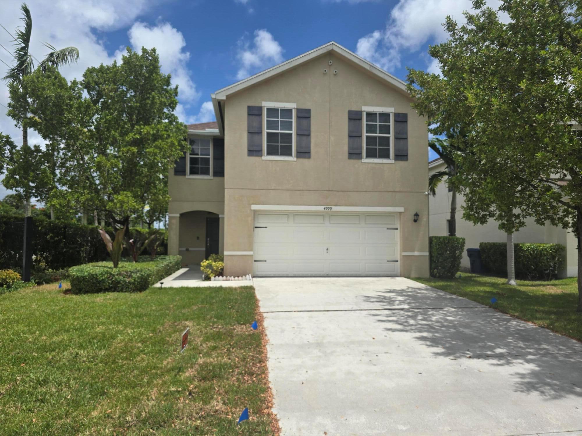 : Imagine waking up every morning in this beautiful 4-bedroom, 2.5-bathroom home, nestled in the vibrant community of Haverhill, Florida. The home boasts an open floor plan with plenty room for family and friends. Enjoy cooking in your kitchen as you entertain. One of the 4 bedrooms can be used as an office or studio. Both full bathrooms have double sinks. The backyard is spacious as all, with plenty room for activities and gatherings. This beautiful home is just a stone's throw away from Florida's renowned beaches, a perfect spot for both relaxation and water sports. New gutters were installed March 2025. A new irrigation system, and sod was installed June 2025.