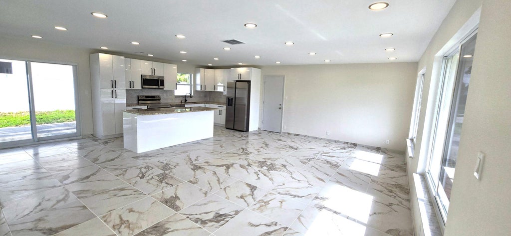 Photo of 303 SW 33RD Terrace, Deerfield Beach, FL 33442 (MLS # B26064509)