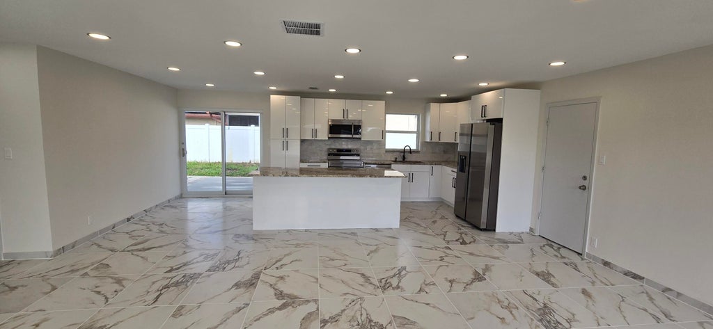 Photo of 303 SW 33RD Terrace, Deerfield Beach, FL 33442 (MLS # B26064509)