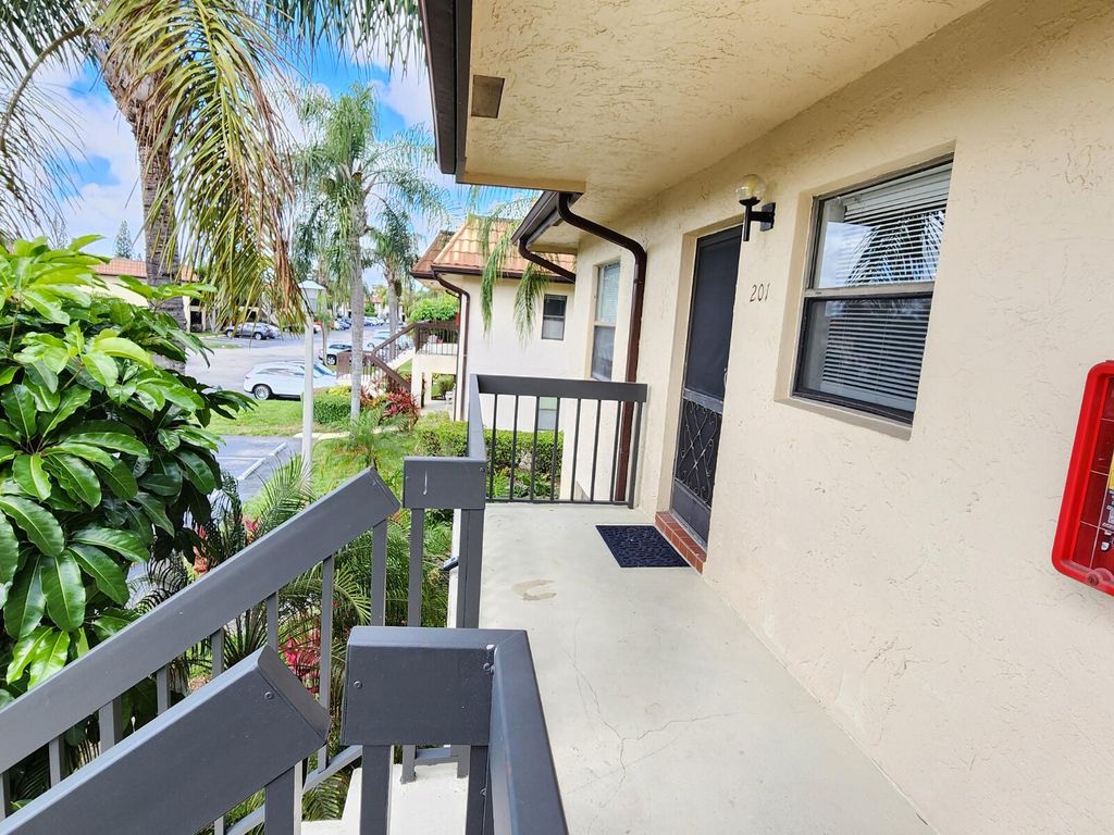 Photo of 7149 Golf Colony Court #201, Lake Worth, FL 33467 (MLS # B26001709)