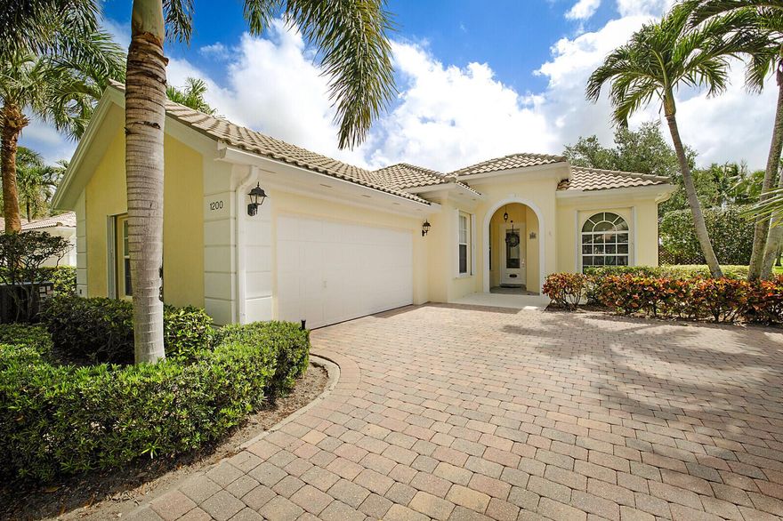 Welcome to this exceptional 3-bedroom plus den, 2-bathroom, single-family pool home in the prestigious Isles at Palm Beach Gardens. Built by Divosta in 2002, this Oakmont model sits on a corner lot and offers direct lake views and high-end upgrades throughout. The spacious open concept great room features soaring 12-foot ceilings, custom built-ins, elegant wood-look tile and crown molding. The chef's kitchen is beautifully designed with white cabinets and granite countertop. The spa-like master bathroom includes dual solid wood vanities, a tiled walk-in shower with upgraded hardware, and a separate soaking tub. Both secondary bedrooms are generously sized and have upgraded fixtures. The versatile den/office boasts is an ideal workspace.
