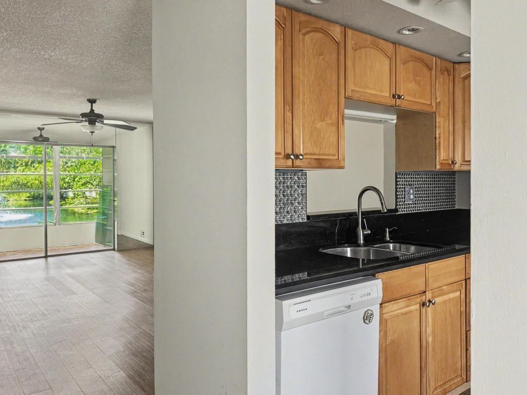 Photo of 5171 W Oakland Park Boulevard #110, Lauderdale Lakes, FL 33313 (MLS # B26004871)