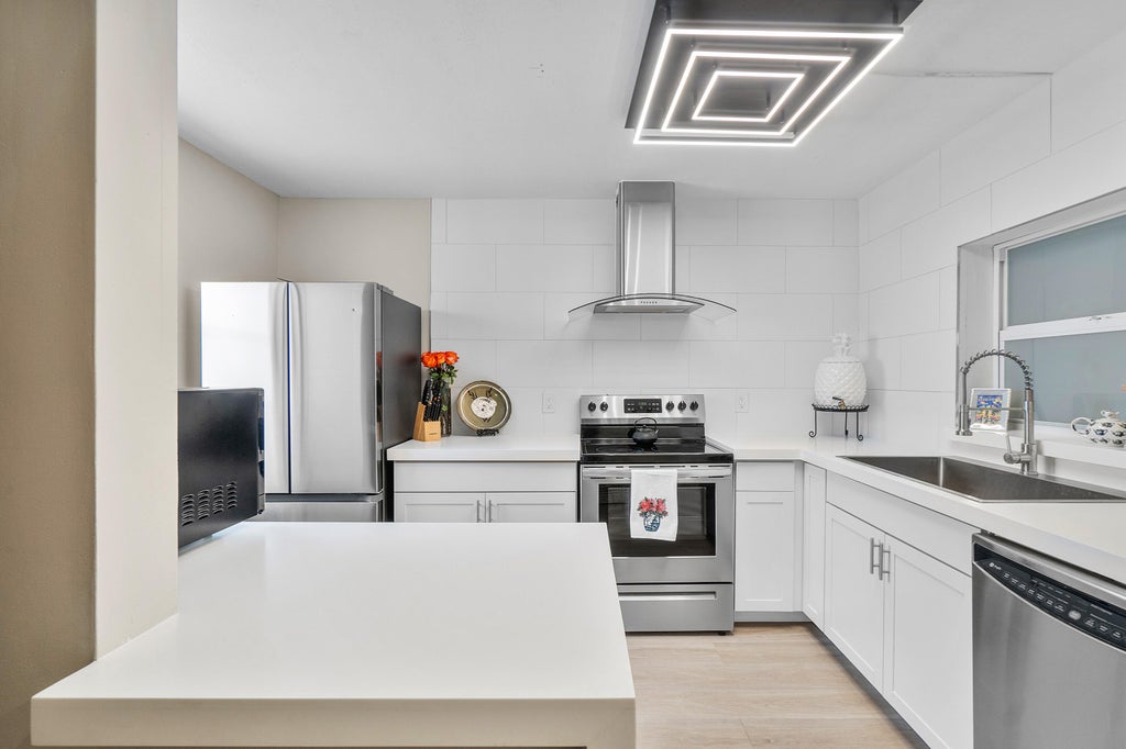 Photo of 2805 SW 22nd Avenue #Unit 104, Delray Beach, FL 33445 (MLS # B26038511)