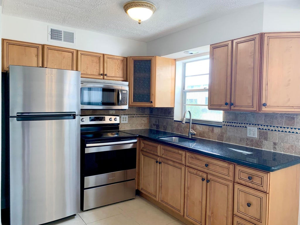 Photo of 130 Sheffield F, West Palm Beach, FL 33417 (MLS # B26036099)