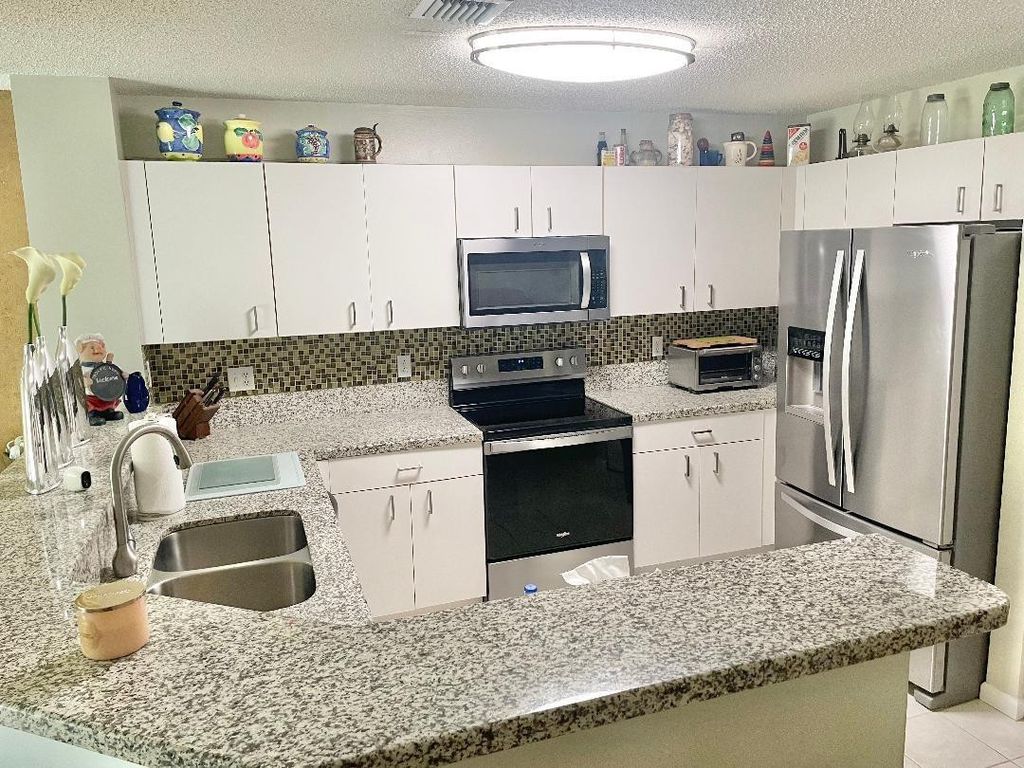 Photo of 718 NW 42nd Place #718, Deerfield Beach, FL 33064 (MLS # F10495684)