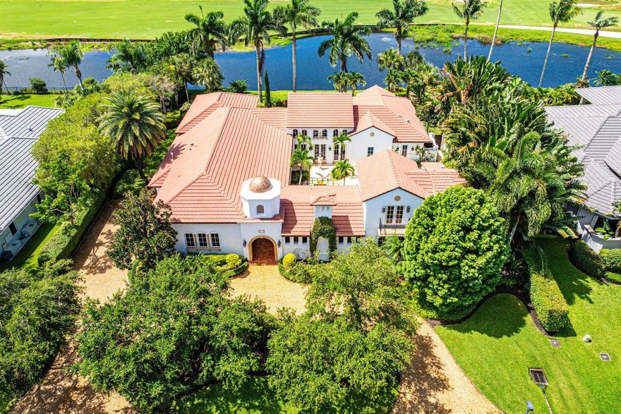 This custom built 4 bedroom, 4.5 bath exquisite courtyard home with a spectacular 2 story guest house is sited on one of the most beautiful lots in Old Marsh Golf Club overlooking water, golf course and endless preserve. This home is truly one-of-a-kind and it's uniqueness was inspired by Palm Beach homes designed by Addison Mizner in the 1920s based on Spanish architecture. The columns and column capitals and most of the stone work were cast from original Mizner molds and the home was built as faithful to original materials used in the 1920s - Saltillo floors, white interior and exterior walls, pecky cypress doors, ceilings and beams, wool carpets, hand-painted tiles indoors and out and solid mahogany doors and kitchen counter.