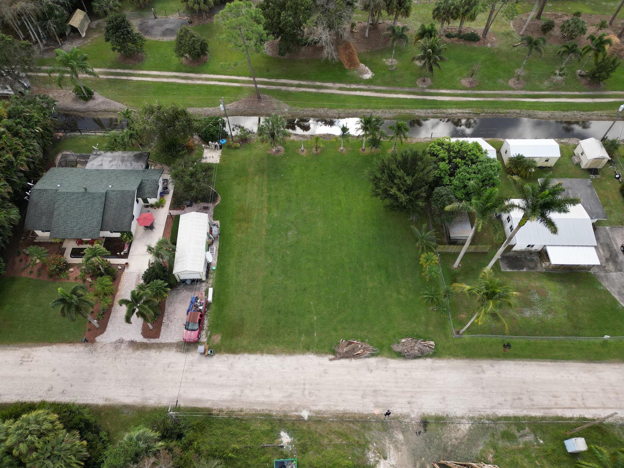 VACANT LOT - RESIDENTIAL, GREAT OPPORTUNITY TO BUILD - CLOSE TO DINING, SHOPS, AIRPORT AND MAJOR HIGHWAYS. PRIME LOCATION. Vacant Land is adjacent to 10824 BARN RD, Lake Worth, Fl.