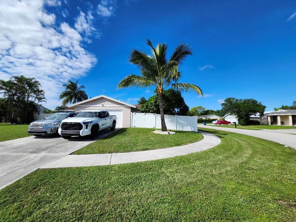 Photo of 1473 Donwoods Ln, Royal Palm Beach, FL 33411 (MLS # R11137290)