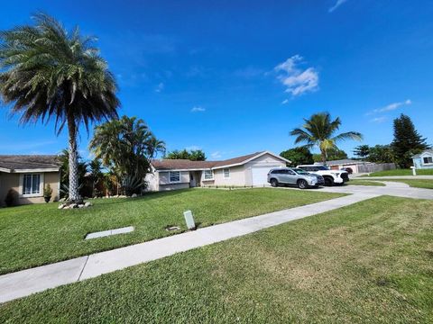 Photo of 1473 Donwoods Ln, Royal Palm Beach, FL 33411 (MLS # R11137290)