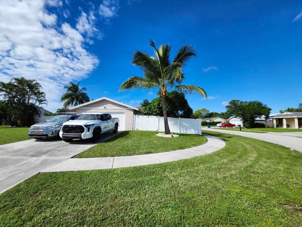 Photo of 1473 Donwoods Ln, Royal Palm Beach, FL 33411 (MLS # R11137290)