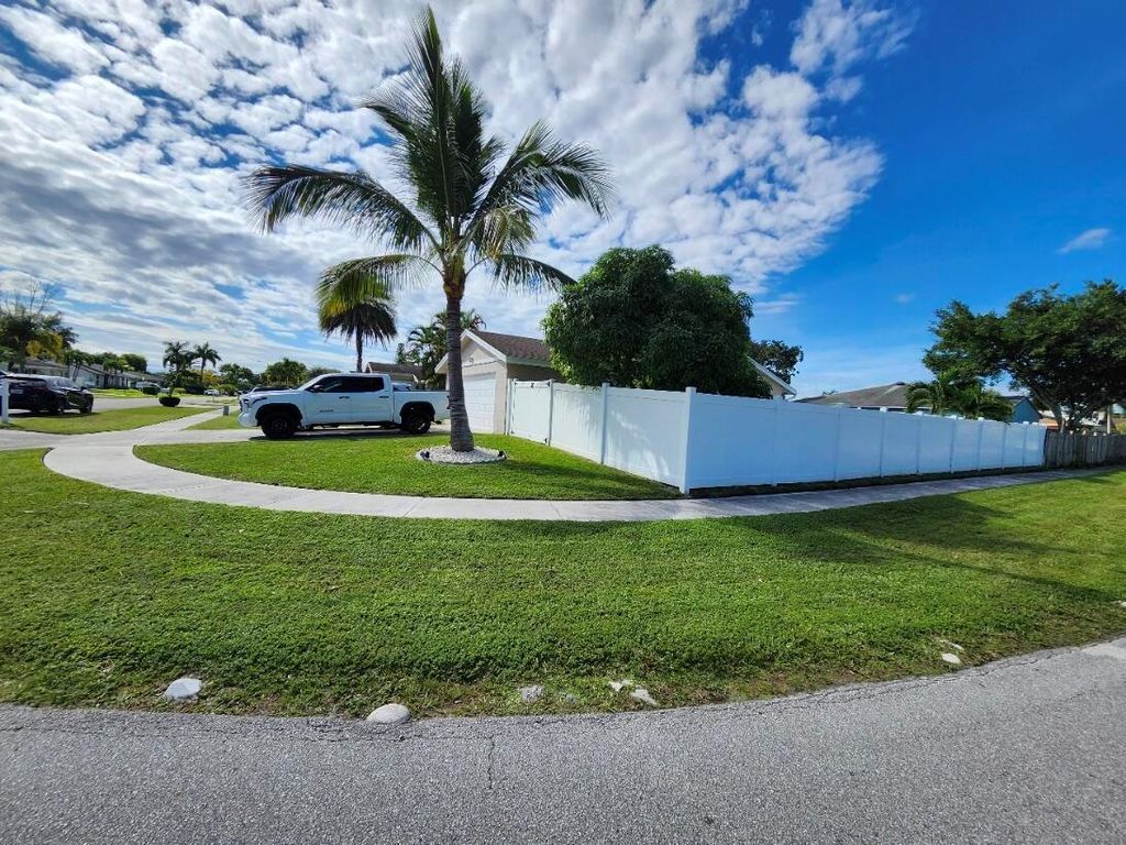 Photo of 1473 Donwoods Ln, Royal Palm Beach, FL 33411 (MLS # R11137290)