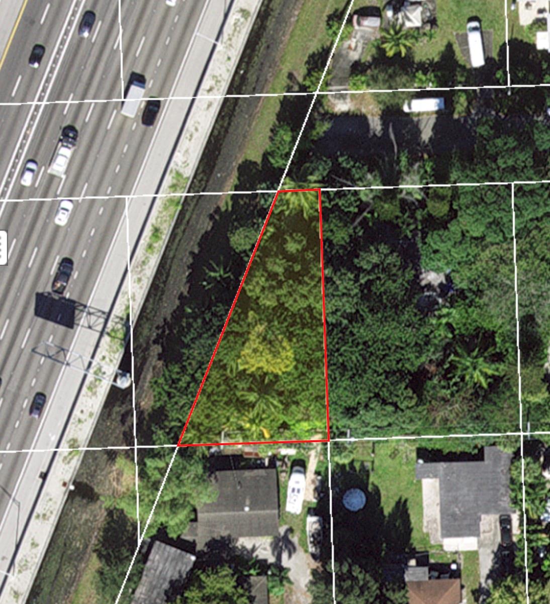 This secluded tropical lot sits next to three properties that are also owned by the same person and are available for purchase, giving you the option to buy additional adjacent lots for a total compound size of +/- an acre. It has wide iron gate opening and a concrete pad. There is currently a vintage trolley sitting on the pad that you may have the option to purchase.
Central to everything, the property is about 4 miles from the beach, 4 miles to downtown Ft. Lauderdale, and a mile from executive airport. FLL Airport is a 15 minute drive and the turnpike is about 10 minutes away. Close to I-95, it's easy to travel North to Palm Beach or South to Miami. There are lots of great restaurants and shopping nearby with 5 major grocery stores and a BJ's Wholesale Club less than a mile away.
