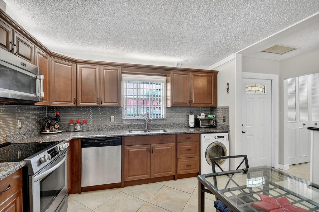 Photo of 165 Amherst Lane, Lake Worth, FL 33467 (MLS # B26011831)