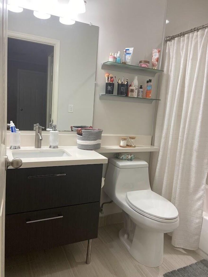 !LOCATION! Beautiful LAKE VIEW townhome in the gated community of Regalo at prestigious Riviera Isles. Fully renovated with Italian-style kitchen cabinetry, stainless steel appliances, and new central A/C (2022). Features crown molding, ceramic flooring on the first floor, and elegant laminate flooring throughout the second floor. Renovated bathrooms with modern finishes. Spacious primary suite with walk-in closet, soaking tub, and separate shower. Bedrooms include blackout roller shades and wood blinds; living room has sliding solar screen panels. Includes full-size W/D, large storage room, 1-car garage, double paver driveway, and guest parking. Resort-style pool, playground, near shopping, I-75, A-rated schools. Photos reflect property prior to being rented. Move-in ready.