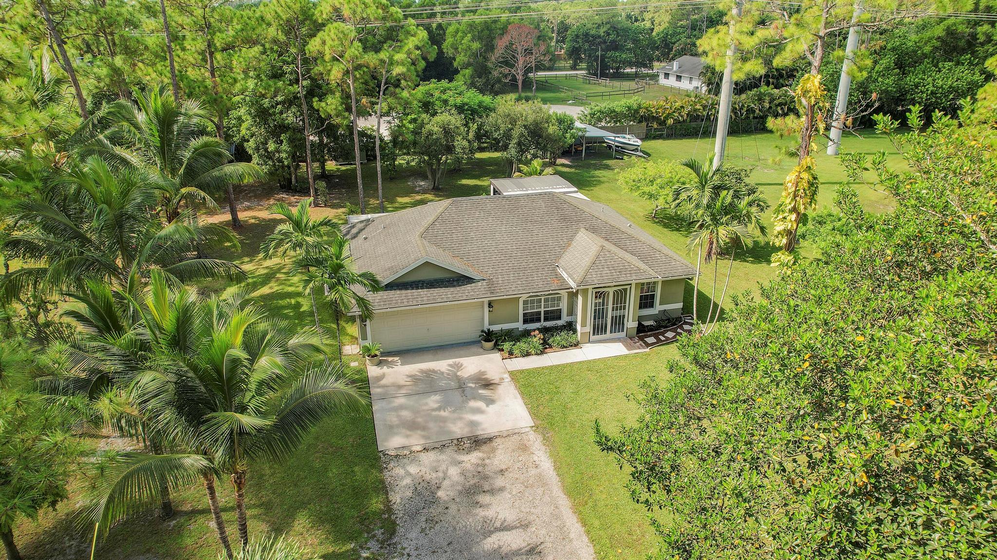Quaint and charming home that sits on over 2 Acres of Land! All animals allowed. Stainless Steel appliances, Wood flooring throughout home (tile in bathrooms). AC three years old, new water system, new stove and refrigerator. Storm Shutters. Amazing LAND, LAND, LAND! Lights and Firepit ready to go!
