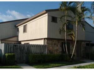 Equal Housing Opportunity. Huge townhouse with 2 master suites! All tile in living areas, extra storage inside and off patio. Large private fenced patio. All appliances including full size washer and dryer. Right next to the Village of Wellington offices, shopping, dining and the Village of Wellington community pool. Ready for occupancy!