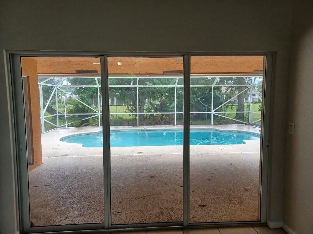 Photo of 266 SW Crescent Ave, Port Saint Lucie, FL 34984 (MLS # F10299305)