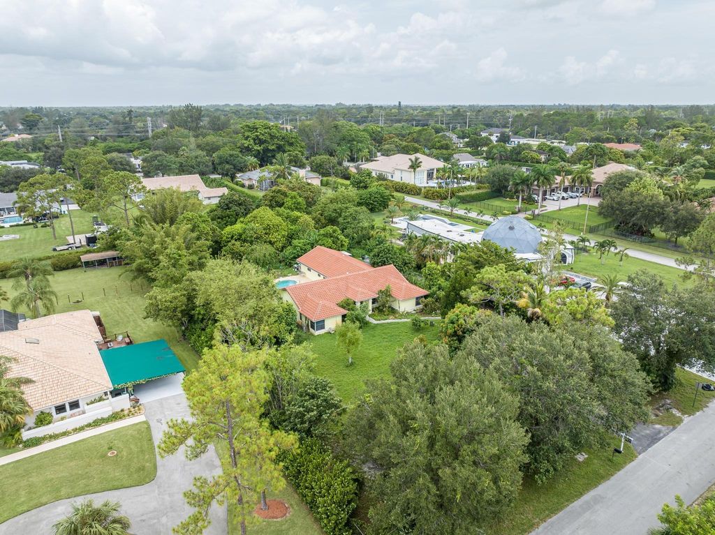 Photo of 6247 NW 66th Ave, Parkland, FL 33067 (MLS # F10391950)