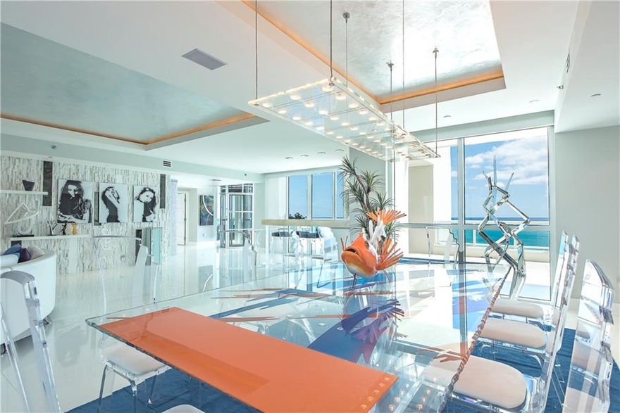 Direct Oceanfront! Imagine the combination of extraordinary Modern architecture with a privately deeded rooftop pool, spa, summer kitchen, bar & terrace capturing the ultimate ocean, city & intracoastal views! Private elevator access to your own roof top retreat.Custom floorplan: expansive open entertaining areas, chefs kitchen, private bedroom suites & entire Master Wing with over 2,000 sf of balconies & views from most rooms. Professional interior designer finishes. Resort quality full amenity building.