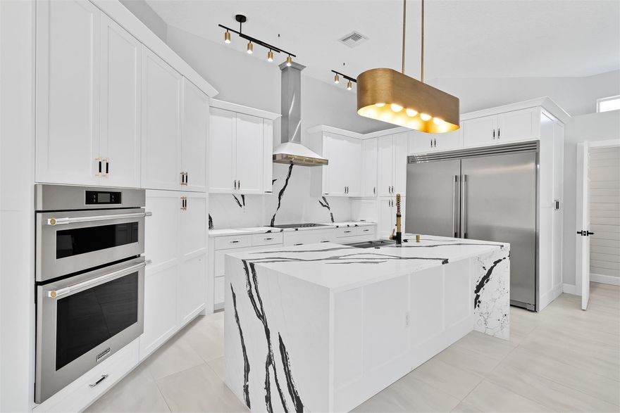 Breathtaking upgrades to this pool home + CASITA! Kitchen is a jaw dropper with STUNNING waterfall Quartz countertops, custom wood cabinetry, 66' fridge, 36' cooktop & vented hood.  Primary bathroom is the epitome of luxury with quartz countertops, soaker tub, floor to ceiling tiled multi-jet shower & custom walk in closet. No surface has remained untouched-even the laundry room is worthy of a look. Home was designed for entertaining with built in bbq & vented hood poolside, custom drybar indoors & relaxing lakeside screened back porch. 2022/23-repiped, ACs, new lighting,paint, molding/casing, 15x30 porcelain tile throughout & so much more. LESS than 1 mile to beach: Neighborhood offers clay tennis, community pool &workout facility. Adjacent to the Historic Jungle Trail for riverside walks